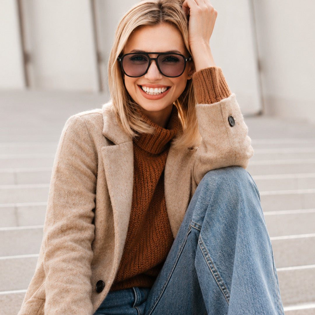 Woman in a chic fall outfit with a leather crossbody bag